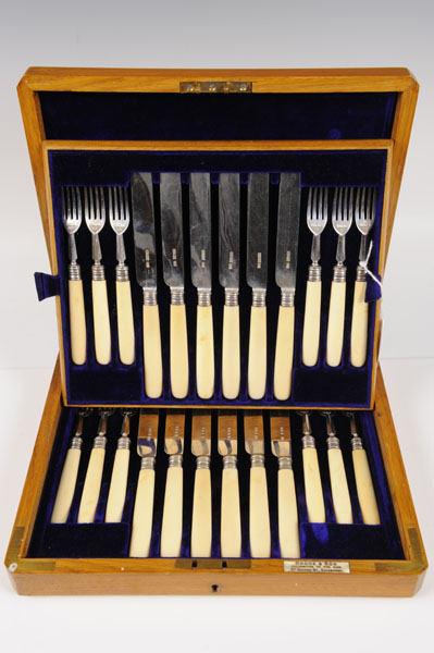 Early Edwardian set of twelve pairs of silver dessert knives and forks with ivory handles, in a