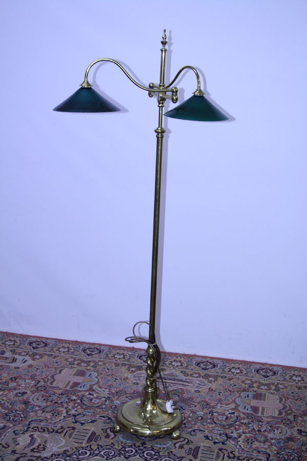 Edwardian brass adjustable twin-branch standard lamp with green glass shades, on circular base