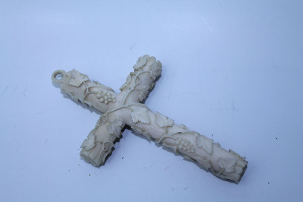 Nineteenth century French Dieppe carved ivory cross pendant with grape vine decoration and