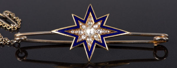 Victorian diamond and enamel star brooch with an eight-pointed star with rose cut diamond centre and