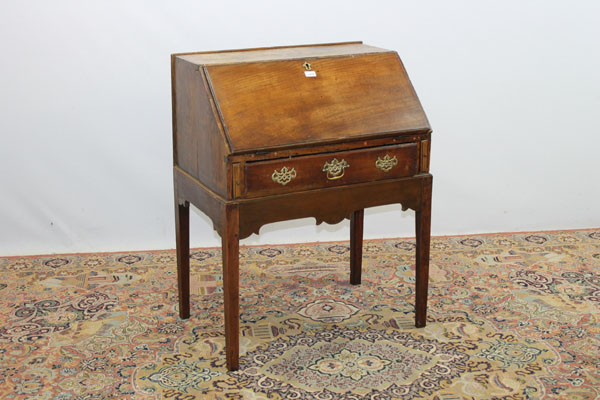 Antique elm bureau with fitted interior, one long drawer and shaped apron below on square taper