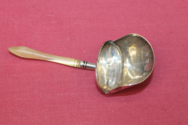 George III silver caddy spoon in the form of a shovel, with engraved initials and mother of pearl