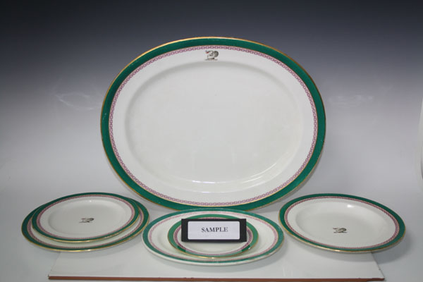 Extensive Victorian armorial dinner service with central swan crest within chain, gilt and green