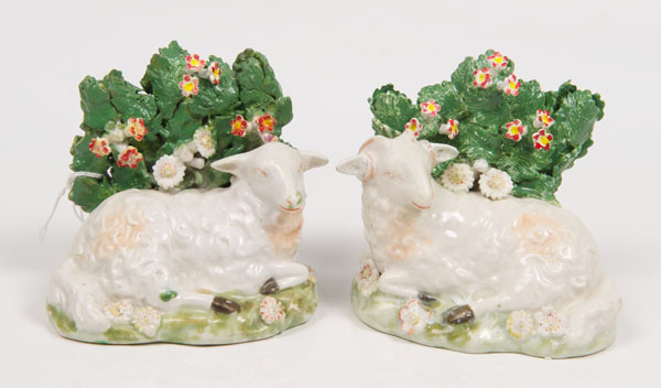 Pair late eighteenth century Derby porcelain figures of recumbent ram and ewe, with bocage, 8.5cm