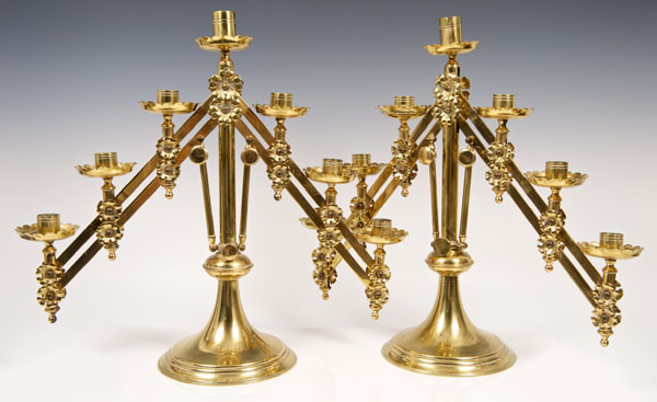 Pair of Victorian Gothic brass adjustable seven-light church candelabra, with flower-head