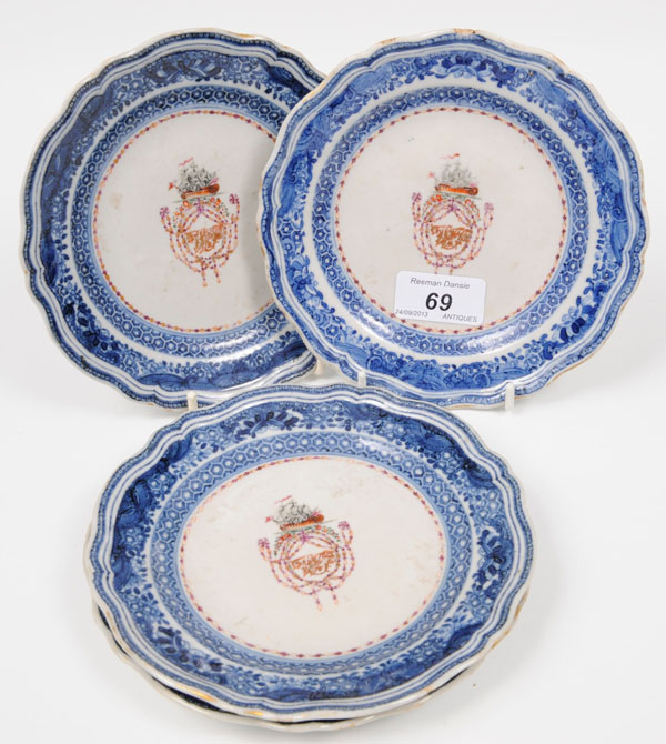 Set of four late eighteenth century Chinese armorial tea plates, painted with an East Indiaman in