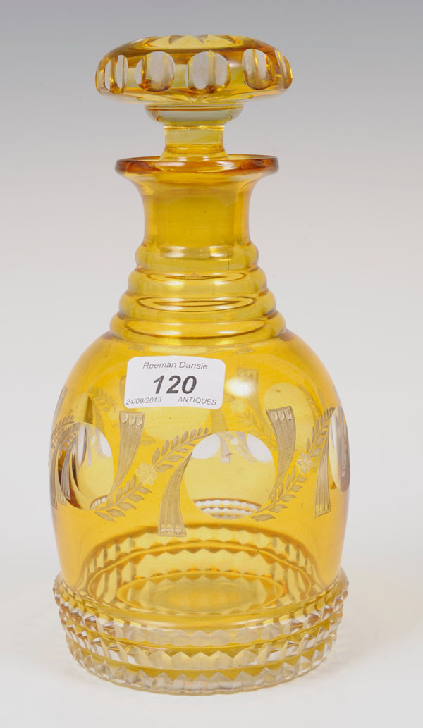 Victorian amber overlaid glass decanter and stopper with cut floral and rosette decoration with