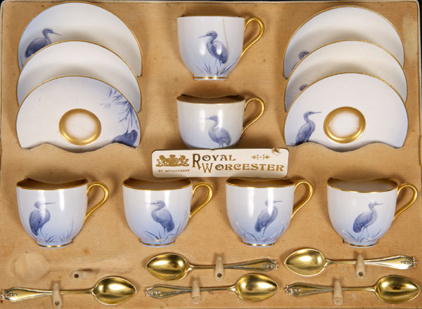 Royal Worcester porcelain coffee set with painted heron decoration on pale blue faded ground,