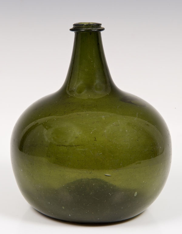 Eighteenth century green glass onion-shaped bottle with collar to neck and bulbous body with deep