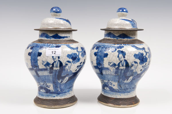 Pair late nineteenth century Chinese blue and white crackle-glazed vases and covers with painted