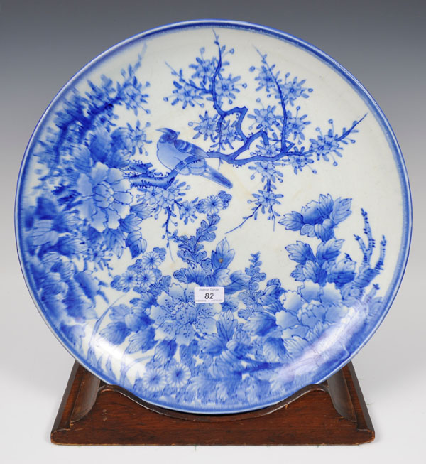 Late nineteenth century Japanese blue and white porcelain charger with bird and floral decoration,