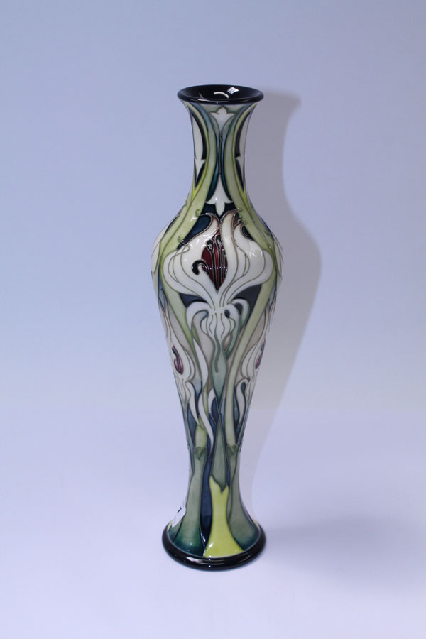 Moorcroft pottery limited edition vase with stylised floral decoration on cream and green ground, by