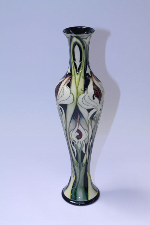 Moorcroft pottery limited edition vase with stylised floral decoration on cream and green ground, by