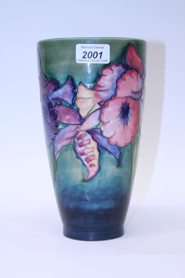 Moorcroft pottery vase decorated in the Iris pattern on blue and green ground, impressed marks and