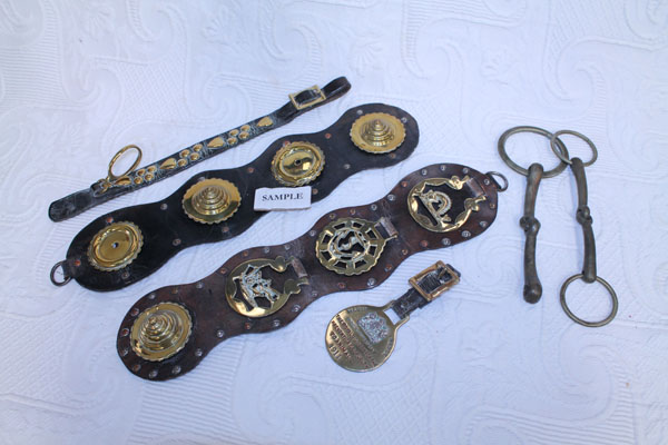 Collection of Victorian and later horse brasses and associated harness, including R.S.P.C.A. Merit