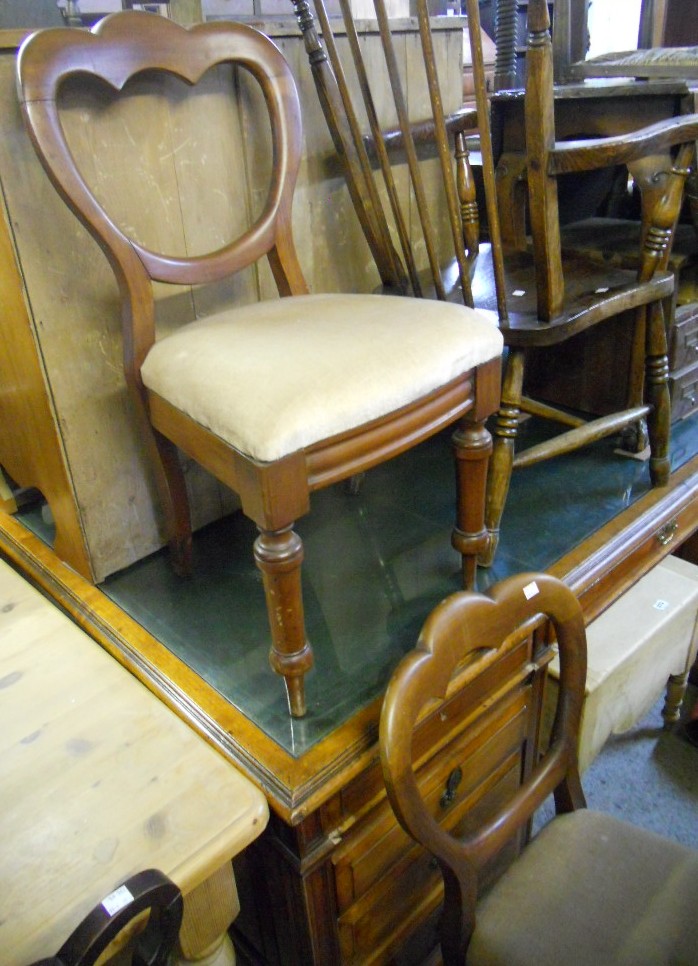 Two Victorian mahogany dining chairs with drop-in seats