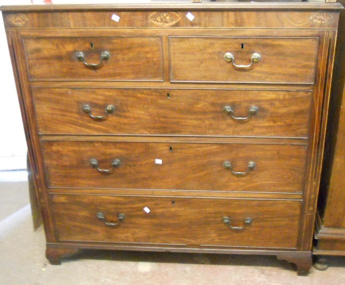 A 4’ Georgian mahogany chest of two short and three long graduated drawers, with decorative shell