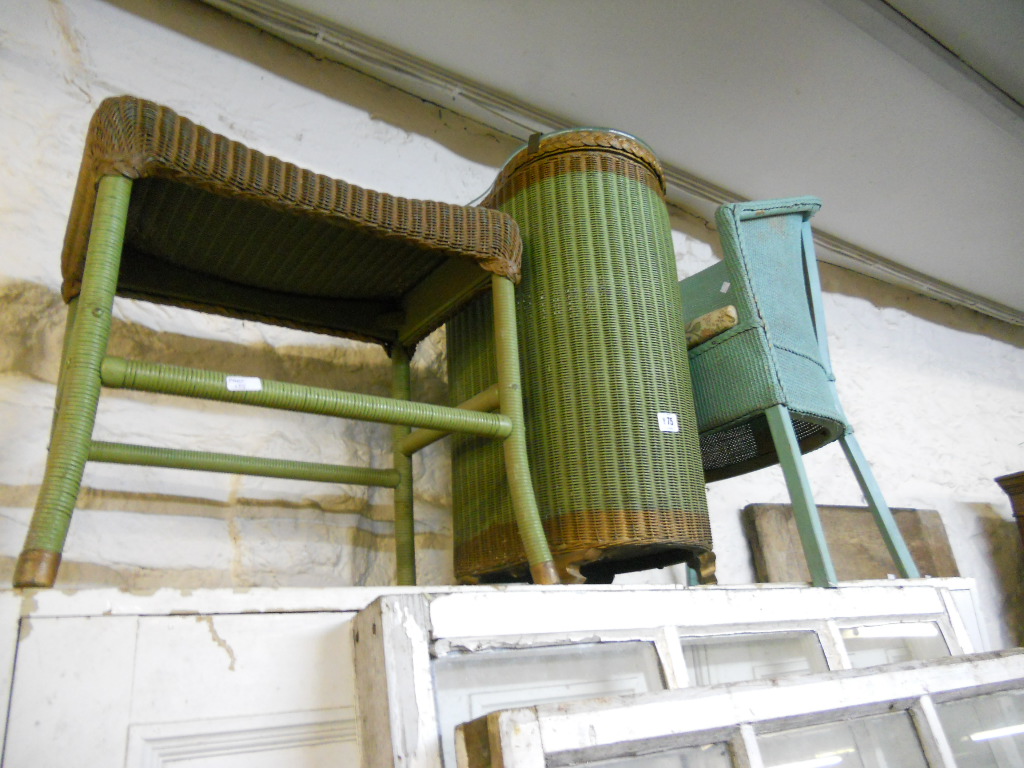 Three pieces of Lloyd Loom style furniture comprising commode, linen basket and stool