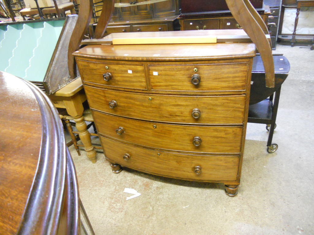 A 3’7” Victorian mahogany bow front chest of two short and three long graduated drawers, set on