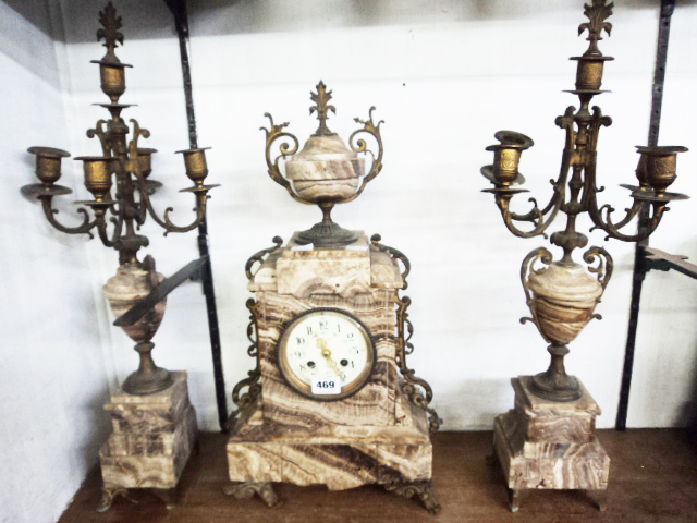 A late Victorian brown marble and gilt metal clock garniture, with J. Marti eight day bell