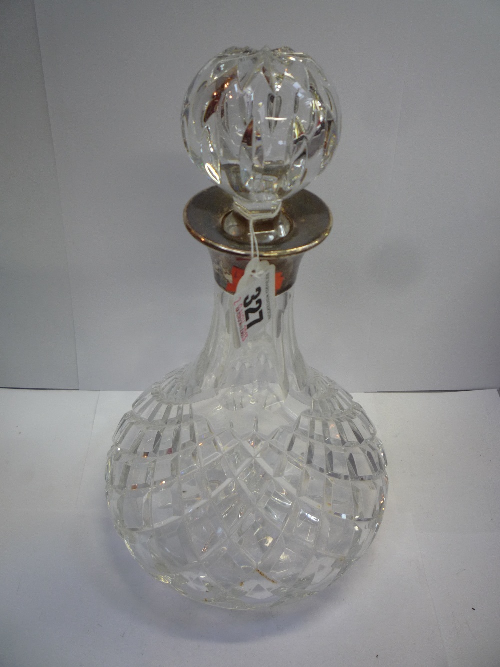 A CLEAR CUT GLASS SHIPS DECANTER, the silver collar Birmingham 1972