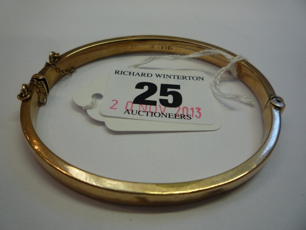 A 9CT BANGLE, (approximately 9g)