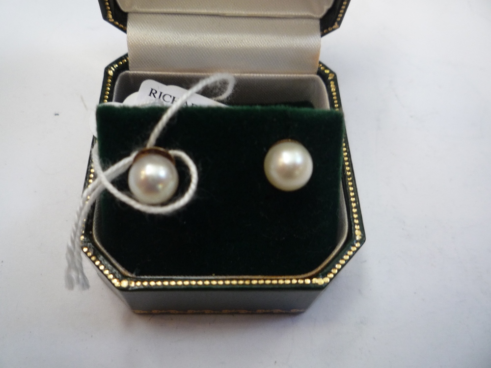 A PAIR OF PEARL EAR STUDS