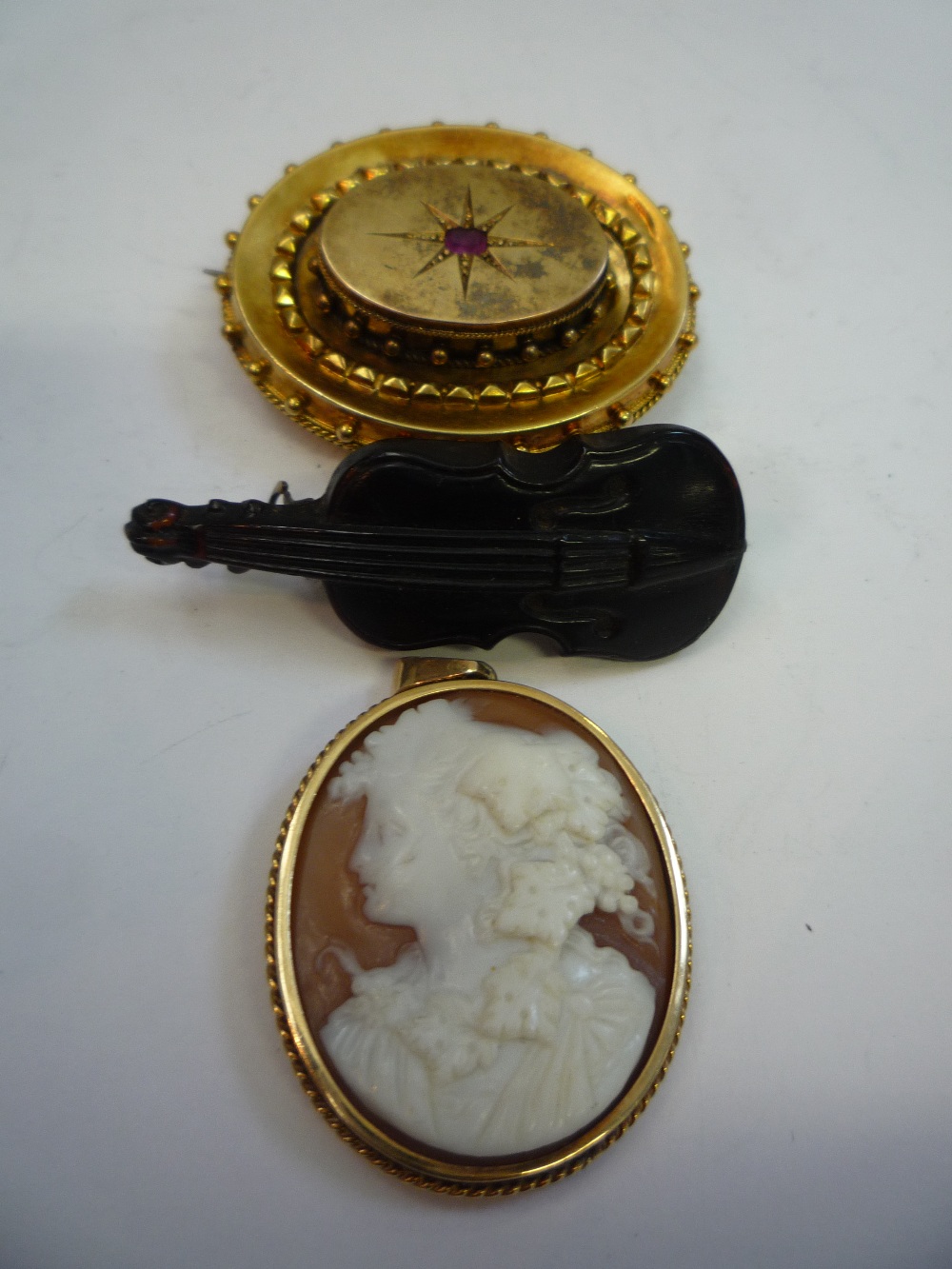 A VICTORIAN MOURNING BROOCH, a cameo and violin brooch (3)