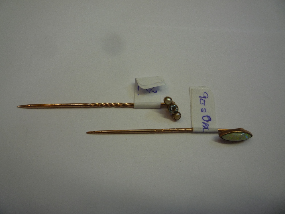 TWO 9CT GOLD STICK PINS, one set with an opal and the other with seed pearls (2)