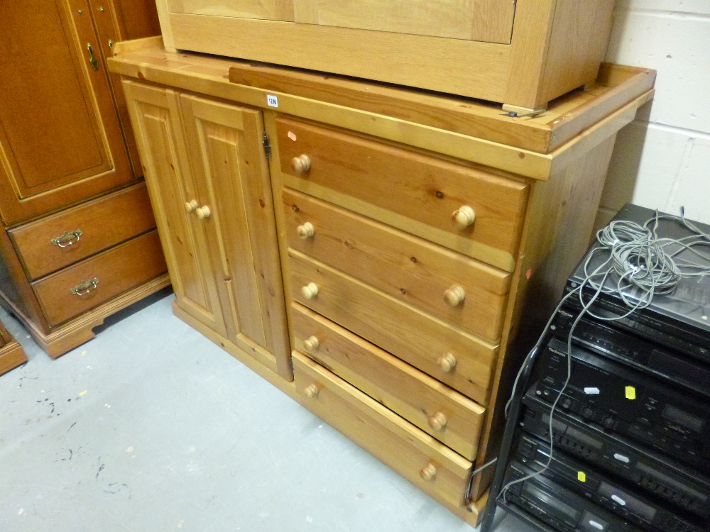 A PINE SIDE CABINET with five drawers, cupboard and gallery top