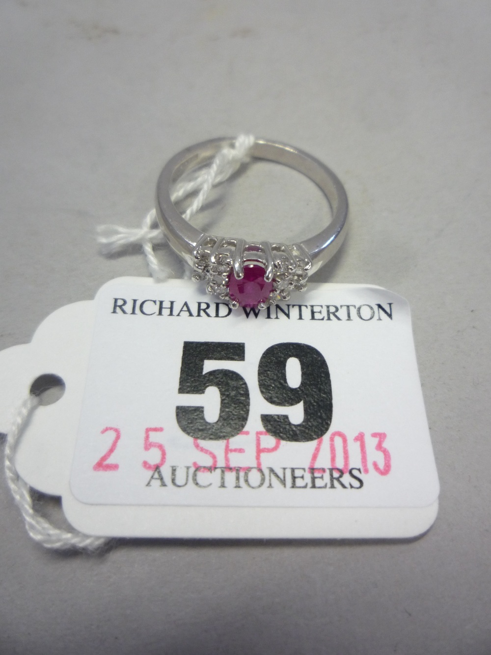 AN 18CT RUBY AND DIAMOND RING