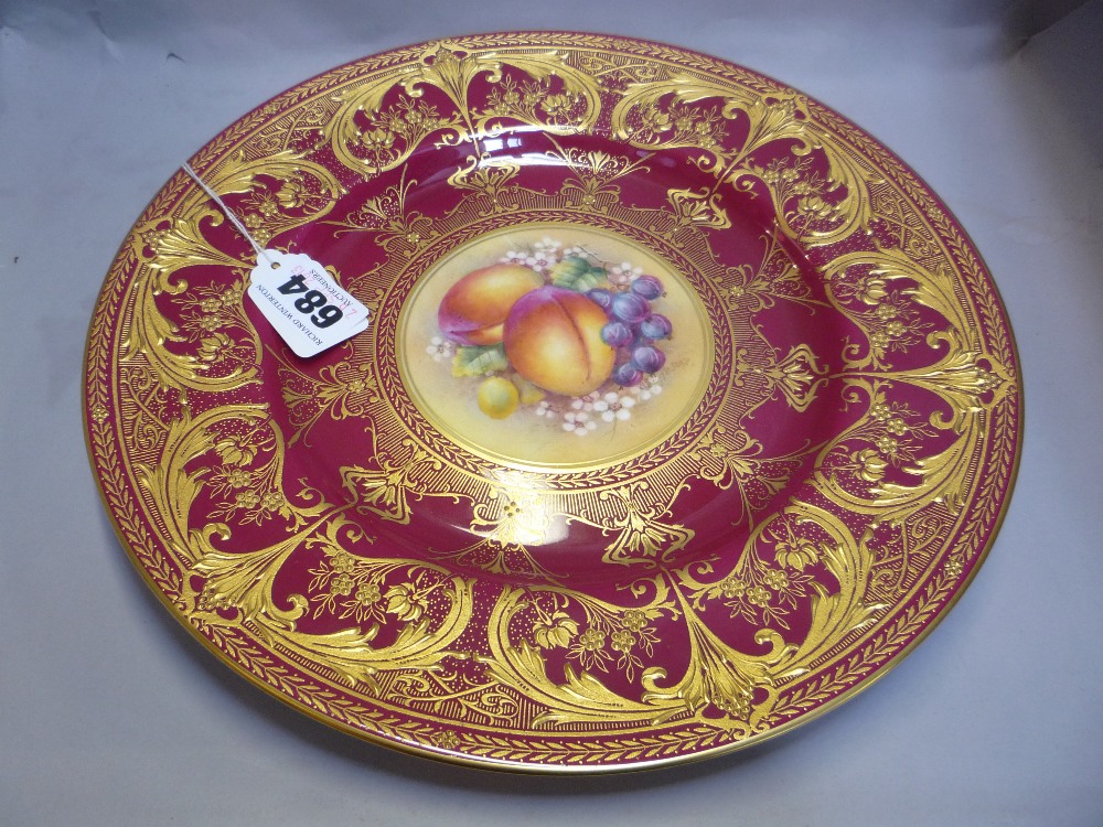 A ROYAL WORCESTER FRUIT PAINTED CABINET PLATE, signed Telford, red and gilt border, diameter 27cm
