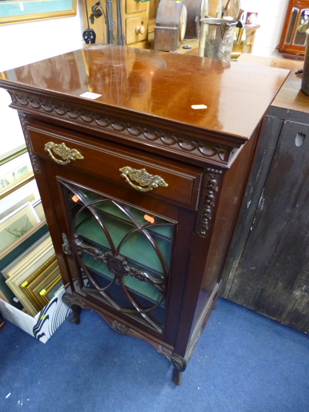 AN EDWARDIAN MUSIC CABINET with single glazed door and drawer to top