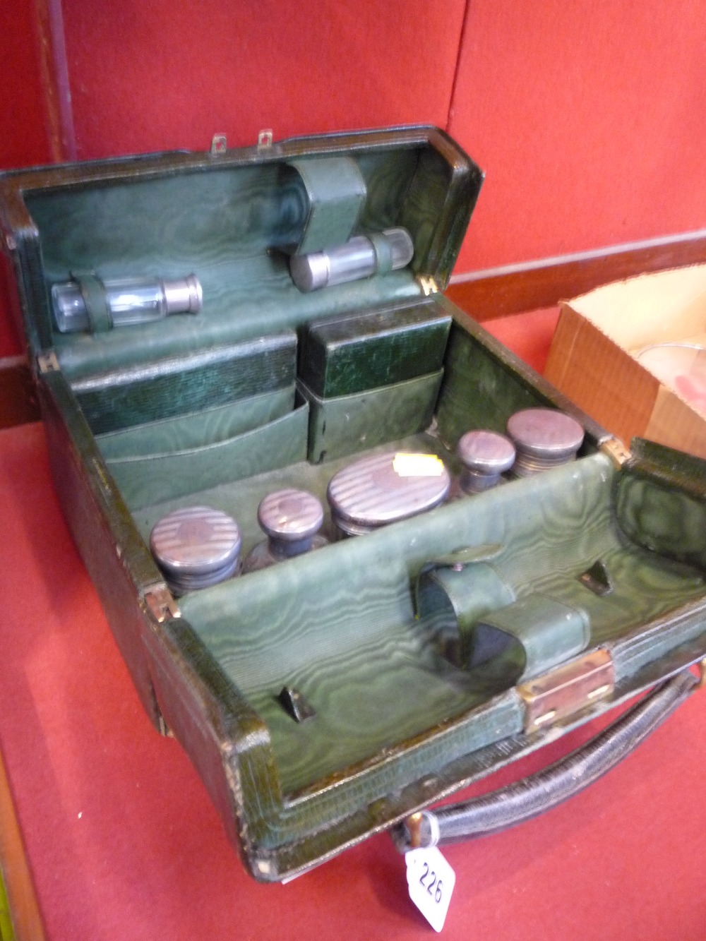 A VICTORIAN GOLDSMITHS GREEN MOROCCO BOUND DRESSING CASE, fitted interior with some silver mounted