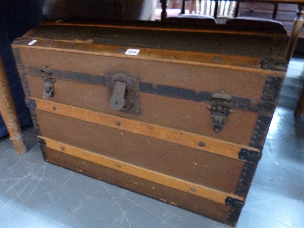 A DOME TOP TRAVELLING TRUNK and a wall mirror (2)