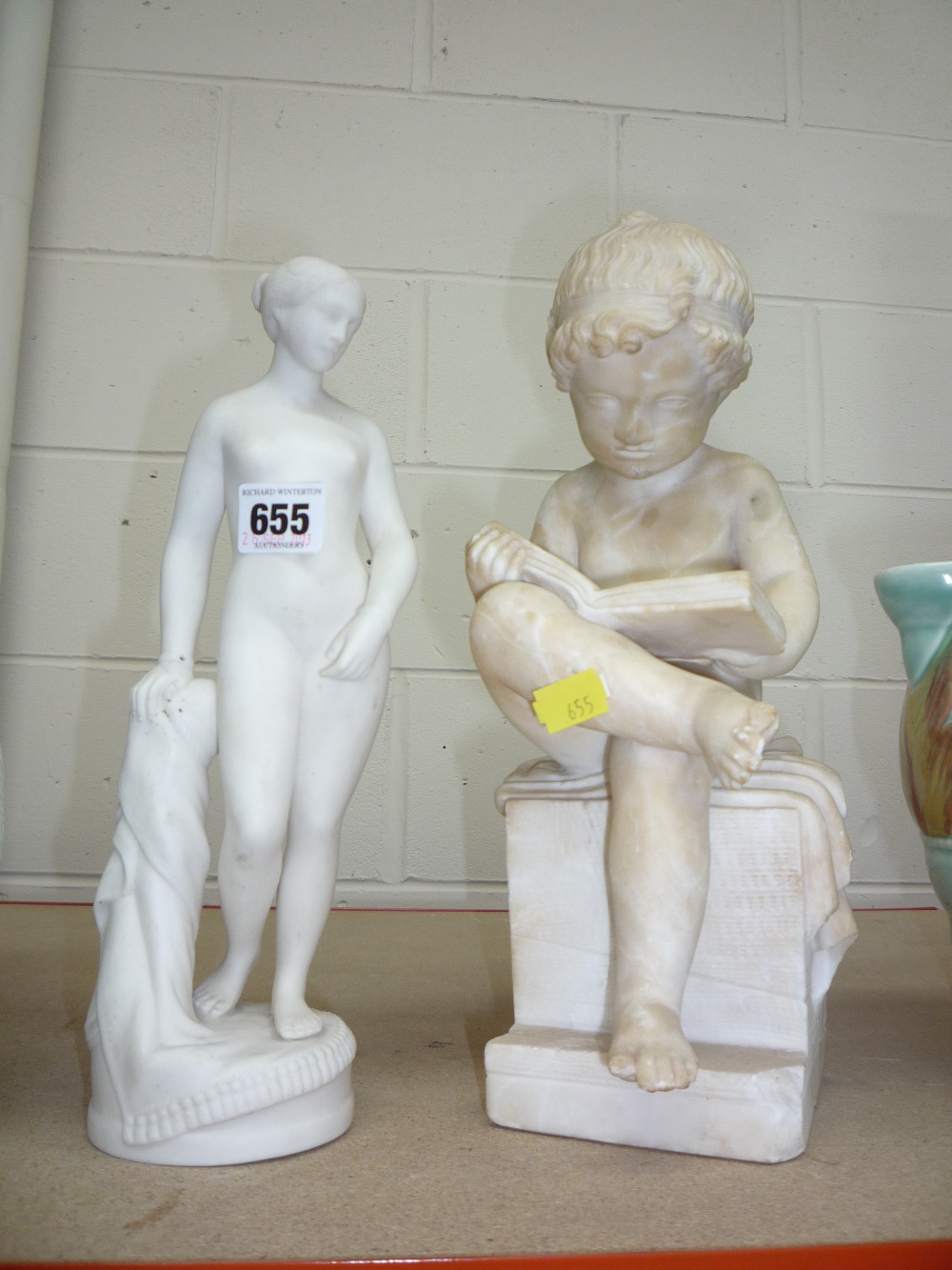 AN ALABASTER CHILD FIGURE, and a Parian figurine (s.d.) (2)