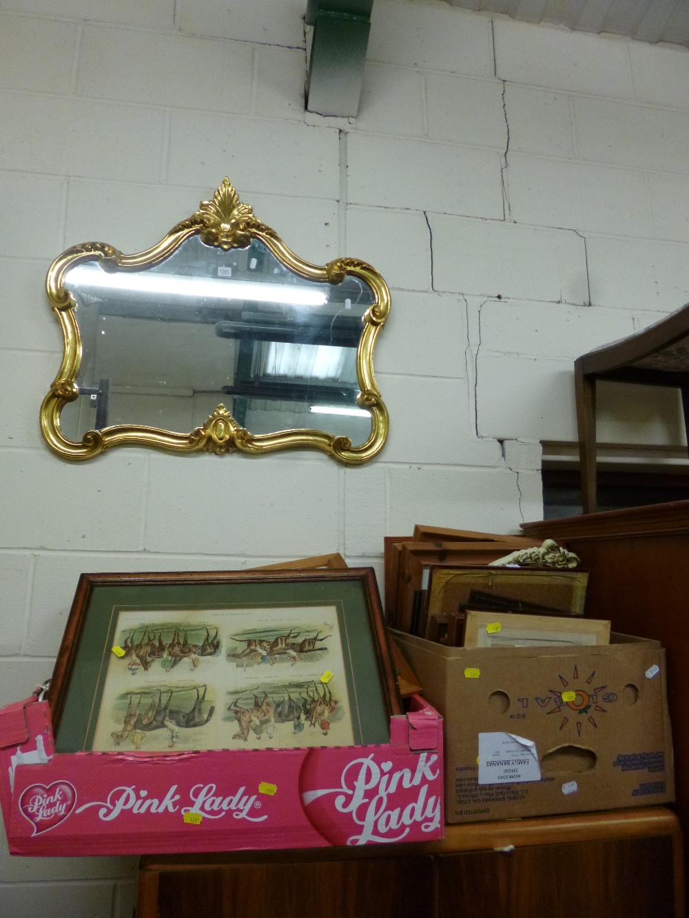 A GILT FRAMED WALL MIRROR and a quantity of pictures