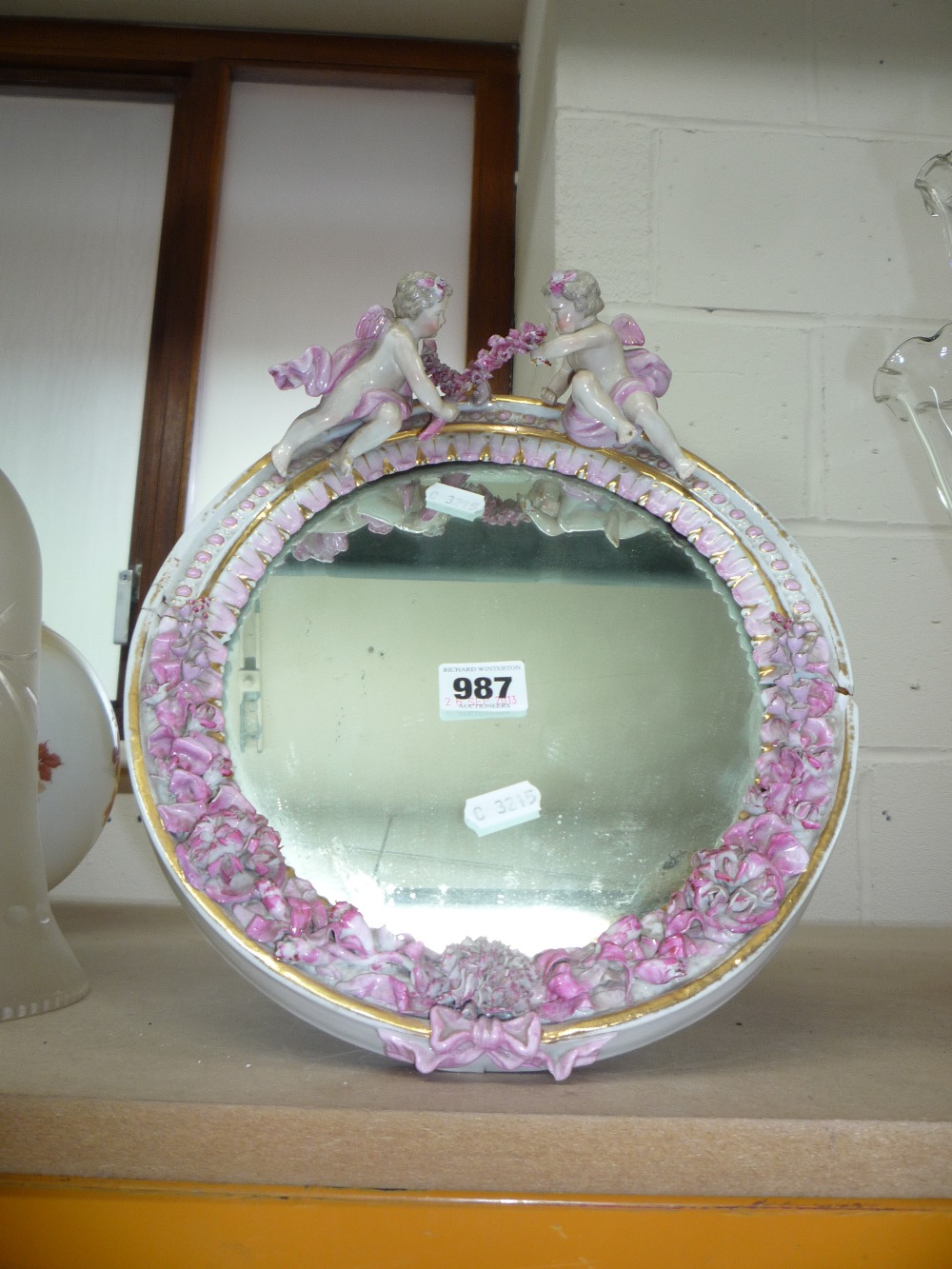 A HARD PASTE EASEL LOOKING GLASS, (s.d.)