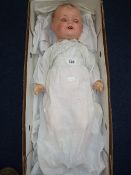 AN ARMAND MARSEILLE BISQUE HEADED BABY DOLL, nape of neck marked AM Germany 542/7K, sleeping eyes,