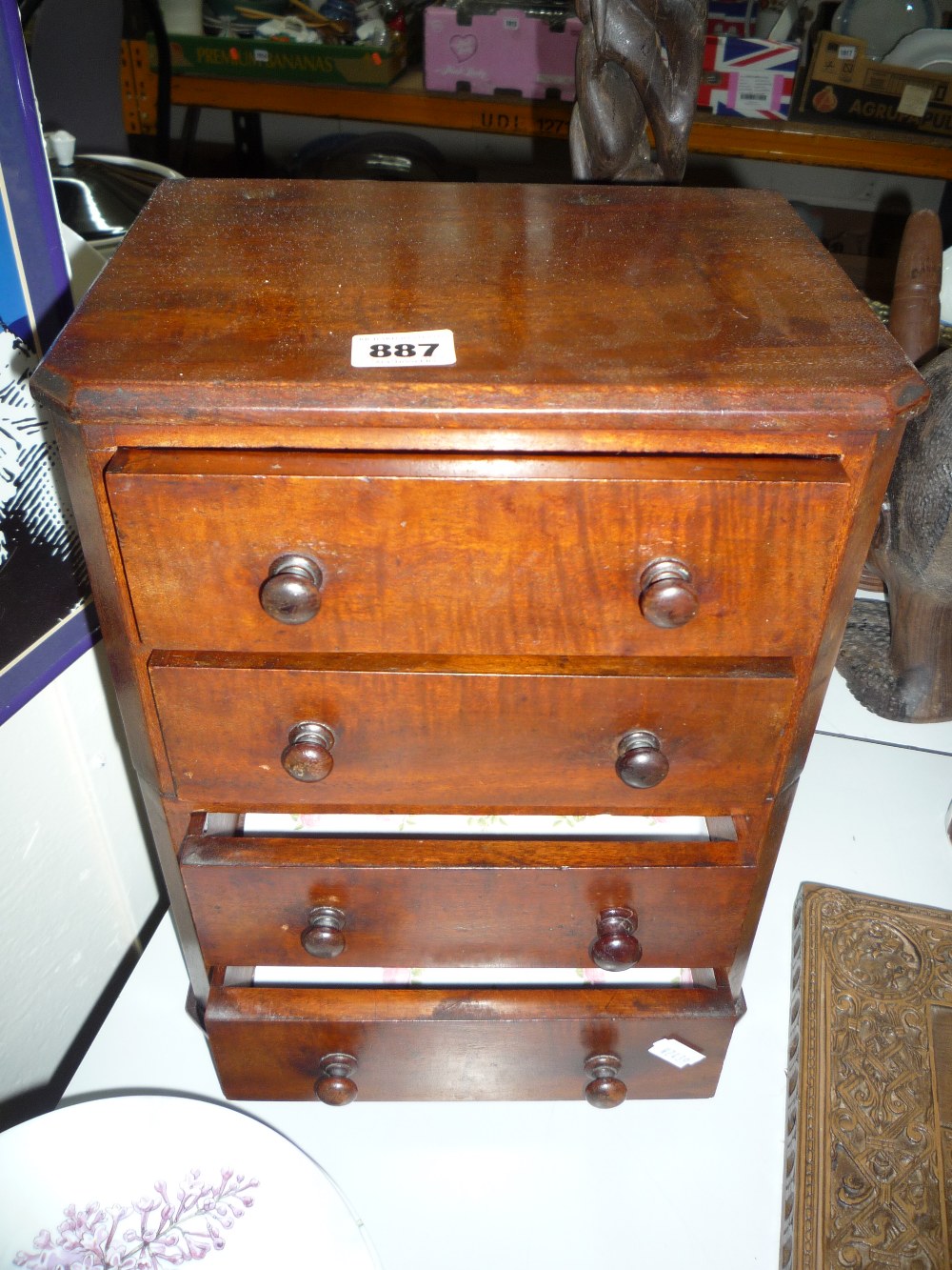 A LATE 19TH CENTURY MINIATURE MAHOGANY CHEST OF FOUR DRAWERS