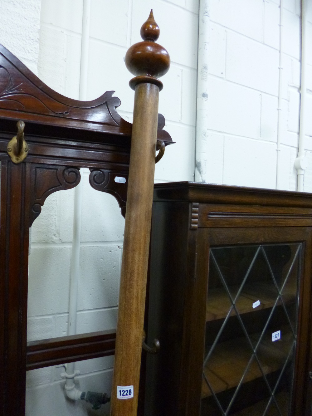 A VICTORIAN MAHOGANY CURTAIN POLE with rings