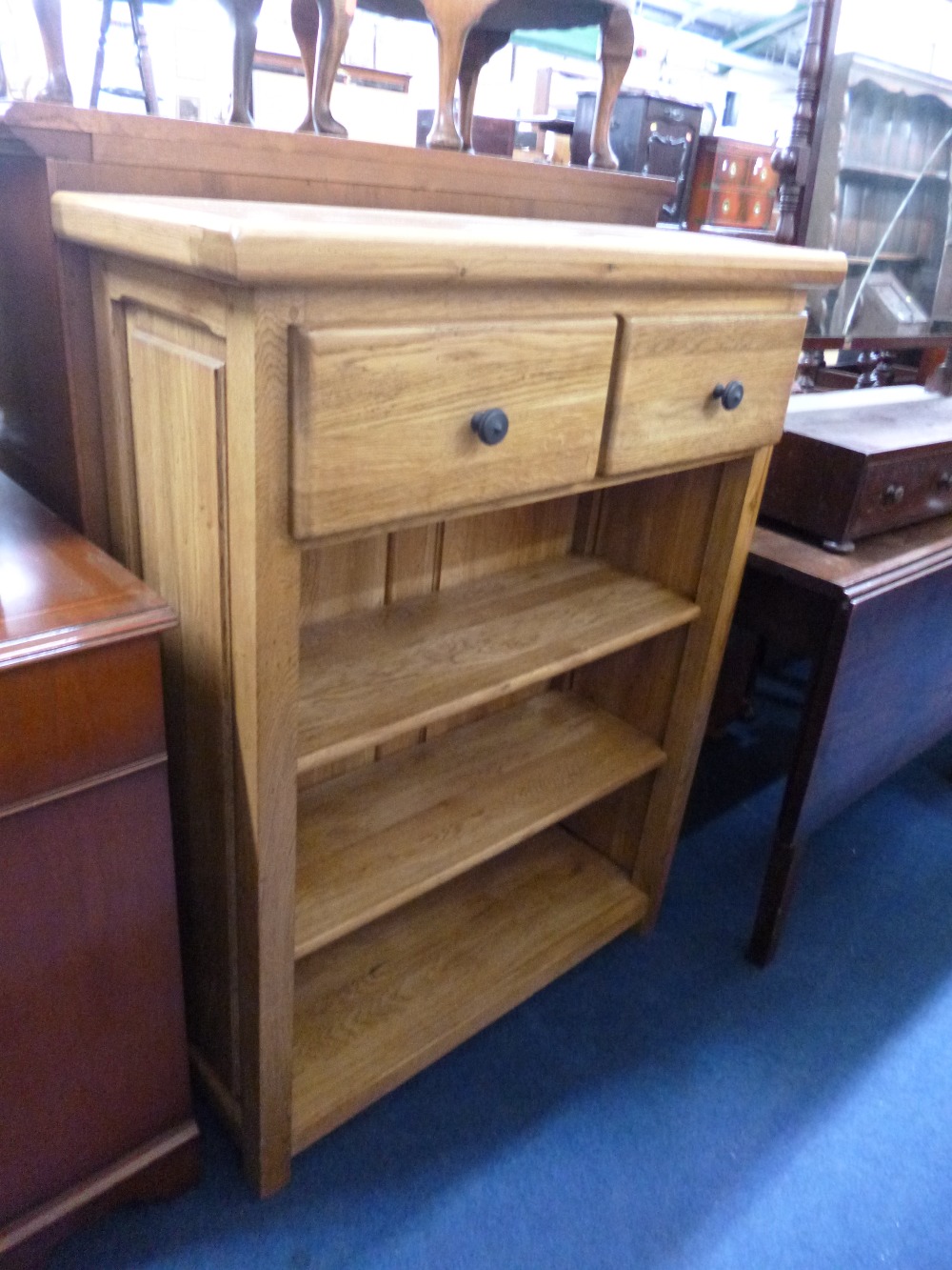 A SET OF MODERN OAK SHELVES with two drawers to the top