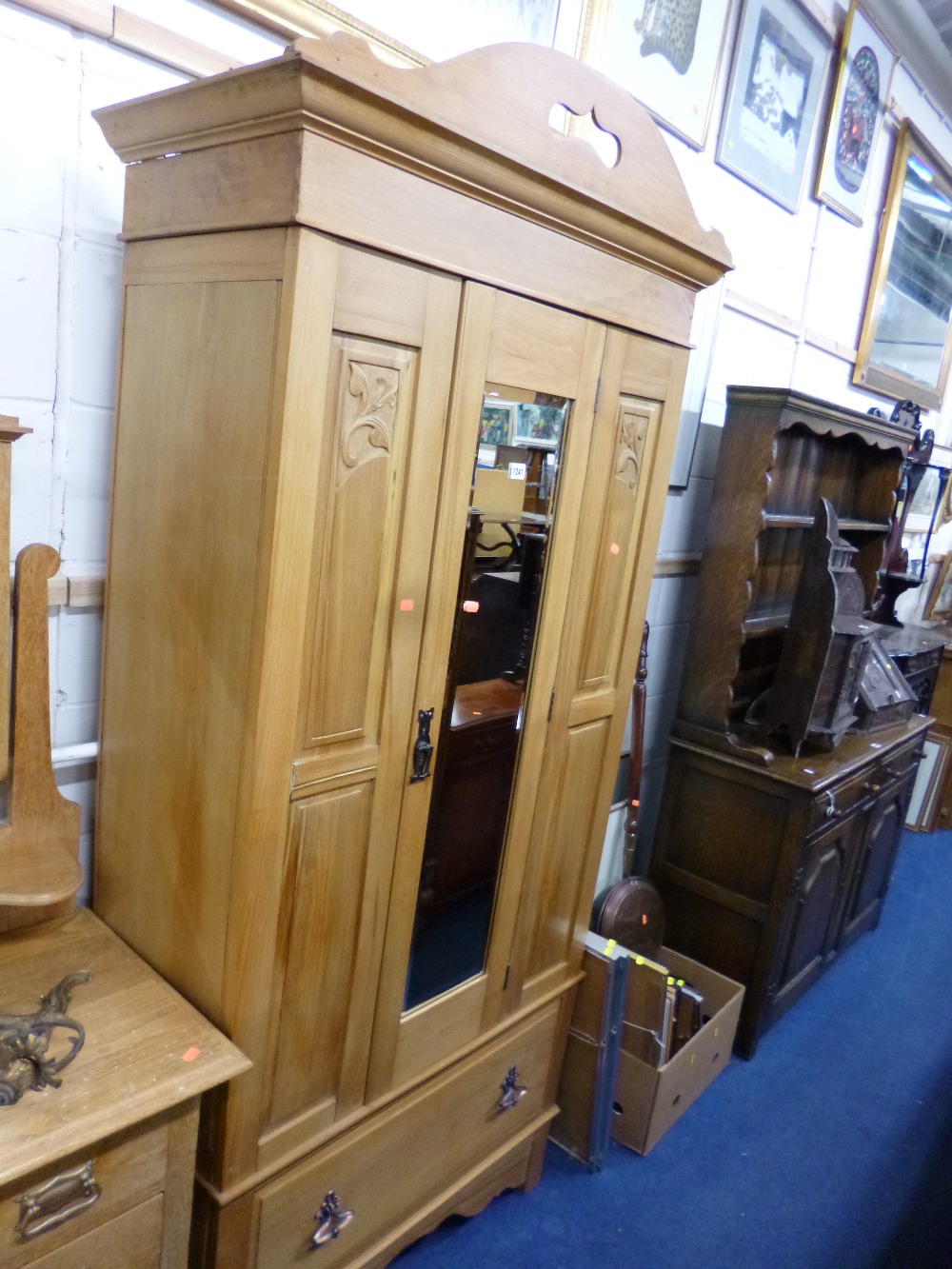 A LATE VICTORIAN/EDWARDIAN MIRROR DOOR WARDROBE with drawer below