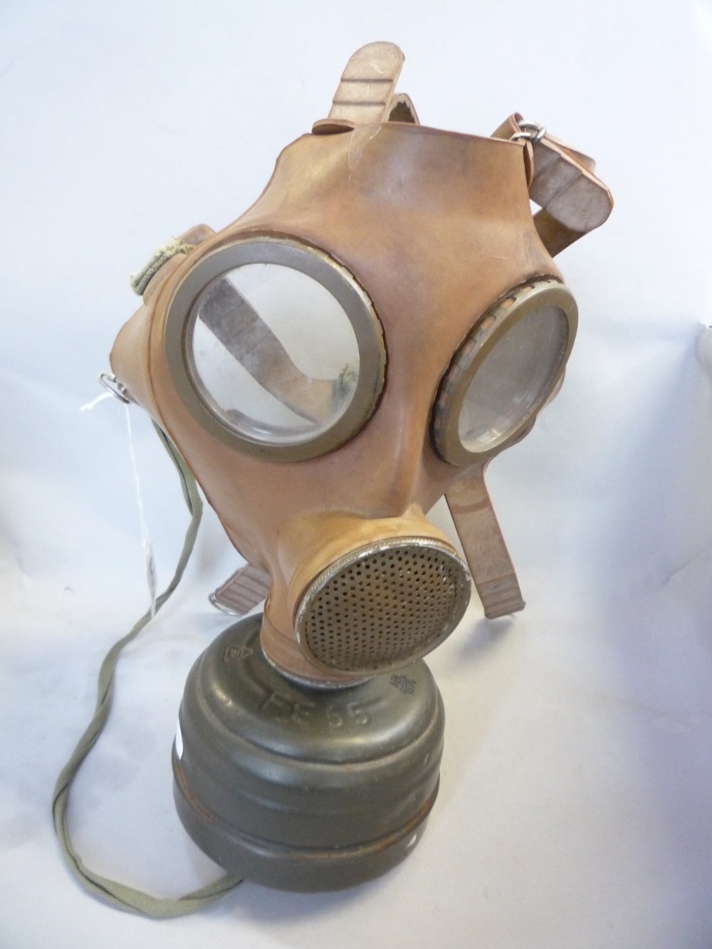 A GAS MASK, c.1950`s (situated in jewellery cabinet)