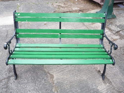 A slatted garden bench with cast iron ends