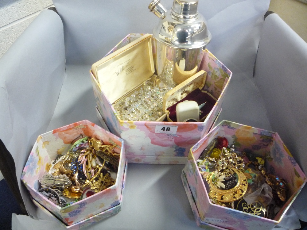 Three boxes of mixed costume jewellery, binoculars, cocktail shaker etc