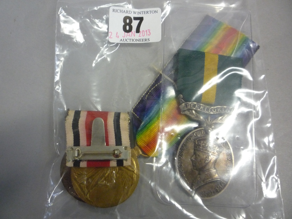 A WWI Victory medal to 58129 PTE. M. Ferguson S. Staff. R., together with an Efficiency medal with