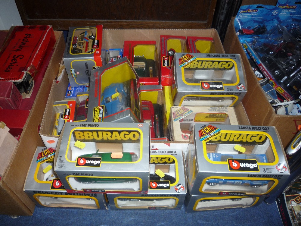 A box and loose boxed Burago die-cast vehicles