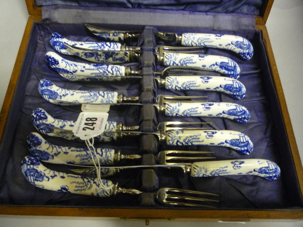 A boxed set of Royal Crown Derby `Mikado` handled fruit knives/forks