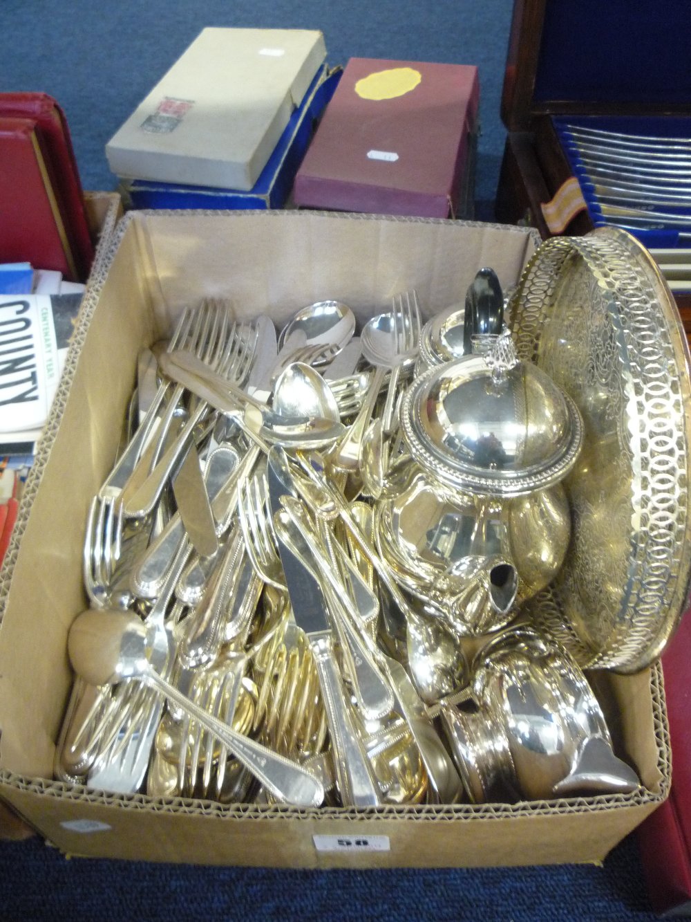 A large box of mixed plated wares